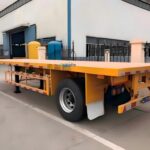 1 axle flatbed trailer carrying a lawn mower and gardening tools, light duty use