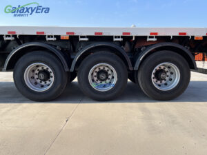 Leaf spring and axle assembly detail of white 40-ton flatbed trailer